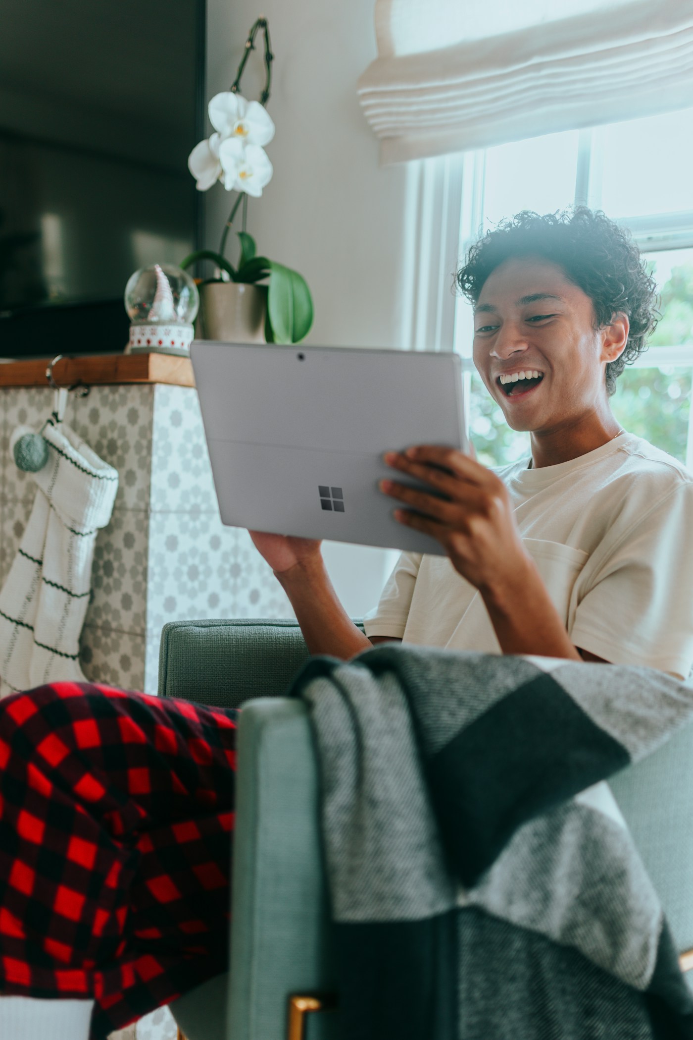 A person using a laptop at home